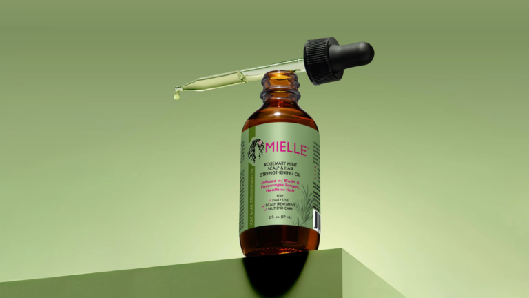 Mielle rosemary mint oil bottle with its pipette on top.