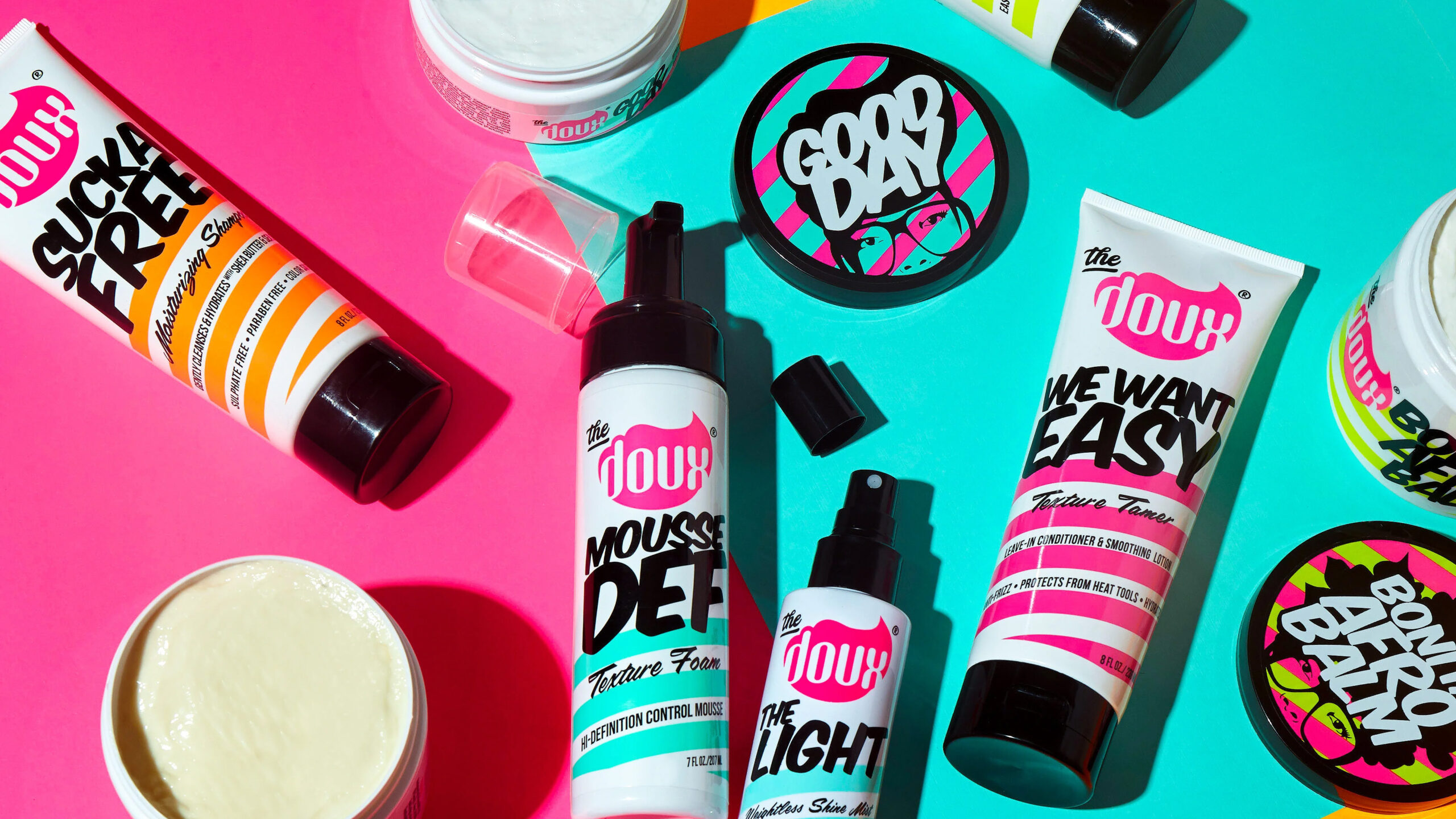 The Doux products laid out on a colorful background
